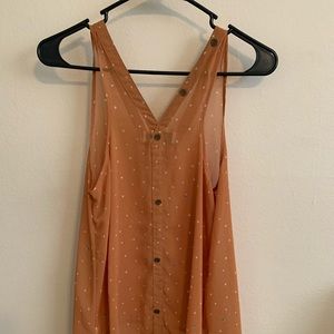 Mustard yellow flowing tank